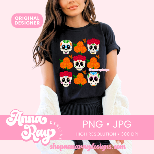 Black t-shirt featuring a grid of six colorful sugar skulls, each adorned with vivid floral designs, expressive eyes, and festive marigold accents. Orange butterflies flutter between the skulls, evoking the spirit of Día de los Muertos and honoring Mexican heritage.